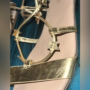 Size 10W gold star sandals from Lane Bryant.